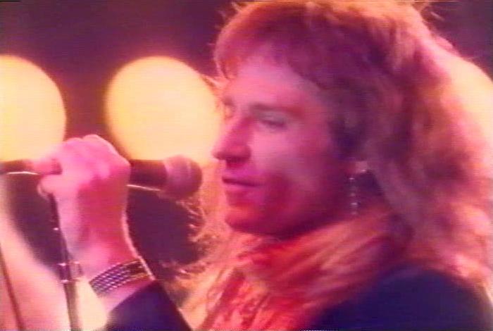 Screenshot from the music video for 'Heaven Is A 4-Letter Word'