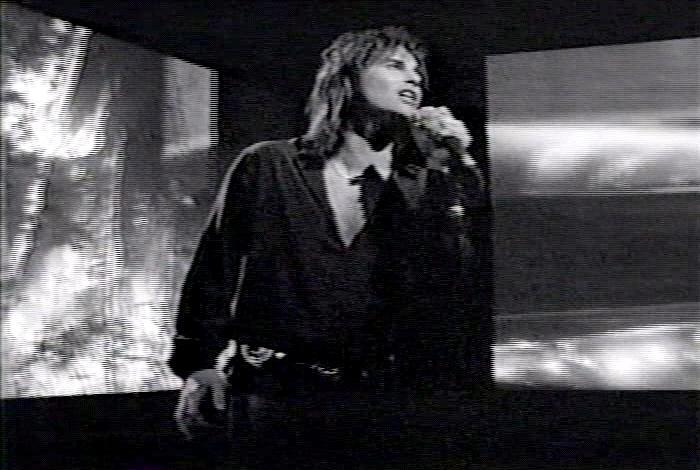 Screenshot from the music video for Survivor's song 'Man Against The World'