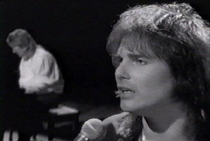 Screenshot from the music video for Survivor's song 'Man Against The World'