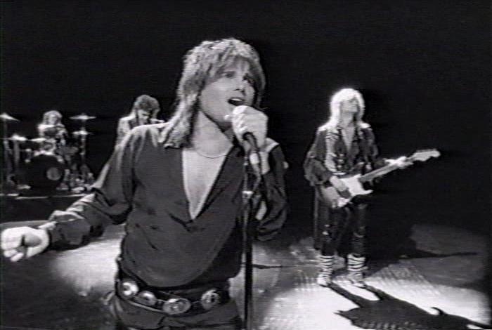Screenshot from the music video for Survivor's song 'Man Against The World'